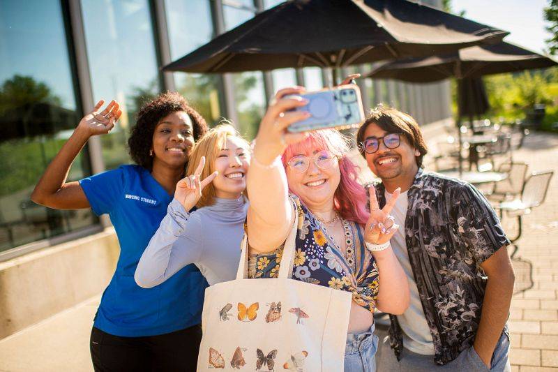 GVSU students taking a selfie on the Allendale campus.